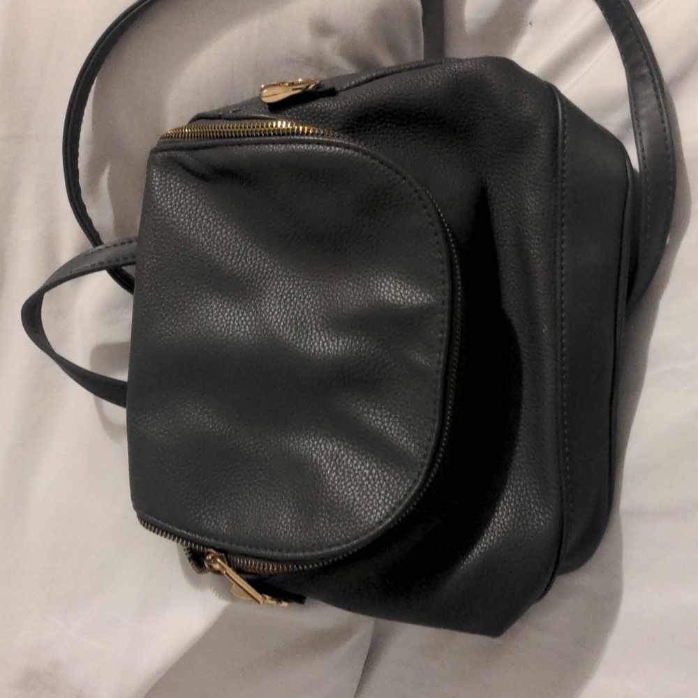 Grey small backpack with adjustable and custom straps